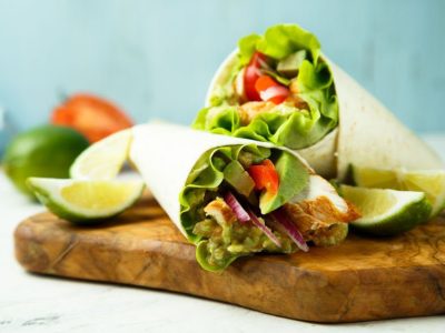 Chicken wraps with green salad and vegetables